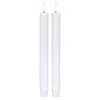 Two white LED candles with flickering flames are shown against a white background. Podgląd zdjęcia produktu