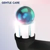 Close-up of a toothbrush head with a glowing orb above it, with text 'GENTLE CARE' at the top. Produktbild-Vorschau