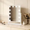 A white makeup mirror with LED lights is displayed on a vanity table.