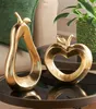 2x Dekofigur "Apfel & Birne" aus Polyresin in Gold, 17 + 26 Produktbild-Vorschau 1