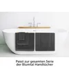 Towels are draped over the edge of a bathtub. Anteprima dell’immagine prodotto