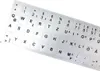 A sheet of silver keyboard stickers with black letters and symbols. Produktbild-Vorschau