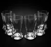 Six clear glasses are arranged in two rows on a black background. Podgląd zdjęcia produktu