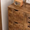 A close-up view of a wooden dresser with two drawers, showing the wood grain texture. Podgląd zdjęcia produktu