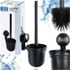 A collage of images showing a black toilet brush and its holder, with some images showing the product in its packaging and others showing close-ups of the brush and holder. Anteprima dell’immagine prodotto