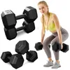 A woman is demonstrating how to use dumbbells for exercise. Produktbild-Vorschau
