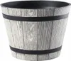 A close-up studio shot of a light gray planter with a wood grain imitation. Podgląd zdjęcia produktu