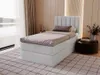 A bedroom scene with a bed, rug, and side table. Produktbild-Vorschau