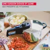 A pressure cooker is shown on a wooden cutting board with chopped vegetables and potatoes in a bowl. Produktbild-Vorschau