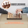 Two people playing chess on a wooden chessboard. Náhled obrázku produktu