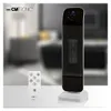 A product shot of a heater and its remote control on a white surface, with a blurred background. Produktbild-Vorschau