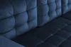 A close-up view of the tufted upholstery of a dark blue sofa. Produktbild-Vorschau