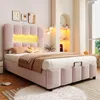 A pink upholstered bed with LED lighting in the headboard, set in a bedroom with decorative elements and a window view. Produktbild-Vorschau