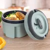 A food container with food inside, placed on a wooden surface with some vegetables around it. Náhled obrázku produktu