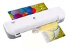 A white Olympia A210 laminator with two photos being laminated. Produktbild-Vorschau