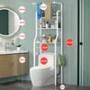 A bathroom scene with a toilet, a shelving unit above it, and a vanity with a mirror to the side. Dimensions are indicated with red circles and text. Produktbild-Vorschau