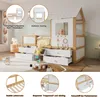 A child's bed with a house-like structure, drawers, and decorative elements, set in a room. Podgląd zdjęcia produktu