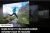 A visual representation of AI upscaling technology on a TV screen, showing a runner in a mountain landscape. Produktbild-Vorschau