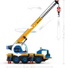 A toy crane model with arrows indicating its movement capabilities. Podgląd zdjęcia produktu
