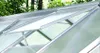 Close-up view of an open greenhouse roof window with aluminum framing and translucent panels. Produktbild-Vorschau