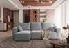 A modern living room with a grey sectional sofa, a coffee table, and decorative elements. Produktbild-Vorschau