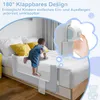 A baby is climbing onto a bed protected by a safety rail. Voir les images du produit