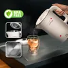 A white electric kettle is pouring hot water into a glass cup, with several inset images showing details of the kettle. Podgląd zdjęcia produktu