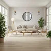 A modern living room with a sofa, chairs, coffee table, and a round mirror on the wall. Anteprima dell’immagine prodotto
