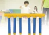 Children playing in a gymnasium with a yellow and blue agility training equipment in the foreground. Náhľad obrázku produktu