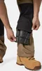 A person is inserting knee pads into work pants. Produktbild-Vorschau