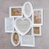 A collage of white photo frames arranged on a gray textured wall. Produktbild-Vorschau
