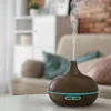 An aroma diffuser emitting mist sits on a white table in a living room setting. Anteprima dell’immagine prodotto