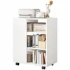 A white cabinet with shelves filled with books and binders, a printer on top, and a decorative bear figurine. Náhled obrázku produktu