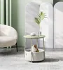 A cat sits in a basket under a round side table in a living room setting. Produktbild-Vorschau
