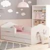 A child's bedroom with a bed, bookshelf, and wall decorations. Produktbild-Vorschau