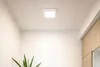 A square ceiling light fixture is mounted on a white ceiling. Náhľad obrázku produktu
