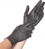 A person putting on black nitrile gloves. Náhľad obrázku produktu