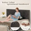 A woman is reading a book on a bed with a button-tufted upholstered headboard. Náhled obrázku produktu