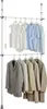 A two-tiered telescoping garment rack with clothes hanging on both levels. Produktbild-Vorschau