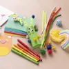 A collection of craft supplies for making monsters and other creatures, including pipe cleaners, googly eyes, pom-poms, markers, and modeling clay. Produktbild-Vorschau
