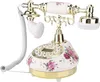 A vintage-style rotary telephone with a floral pattern. Náhľad obrázku produktu