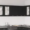 A modern kitchen with black wooden cabinets and white walls. Produktbild-Vorschau