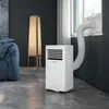 A portable air conditioner is set up in a modern living room, with its exhaust hose connected to a window. Náhled obrázku produktu