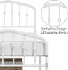 Close-up view of a white metal bed frame with decorative elements and a mattress. Produktbild-Vorschau