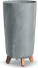 A tall, cylindrical planter with a marbled gray finish and three wooden legs. Produktbild-Vorschau