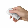 A hand holding a remote control. Produktbild-Vorschau
