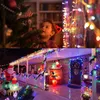 A collage showing a child looking at a Christmas tree and a house decorated with Christmas lights and inflatables. Produktbild-Vorschau