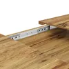 A close-up view of a wooden table extension mechanism, showing the metal drawer slides and the wood grain of the table. Anteprima dell’immagine prodotto