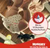 A baby wearing a diaper is shown upside down, with a marketing graphic overlay. Náhľad obrázku produktu