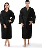 A man and a woman are shown wearing black bathrobes. Podgląd zdjęcia produktu
